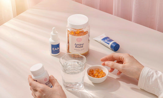 Ingredient flat-lay of EAA gummy supplements with water and a small bowl.